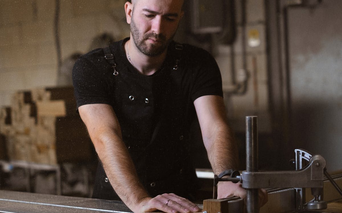 Maker at the workbench in the Wang Lik workshop